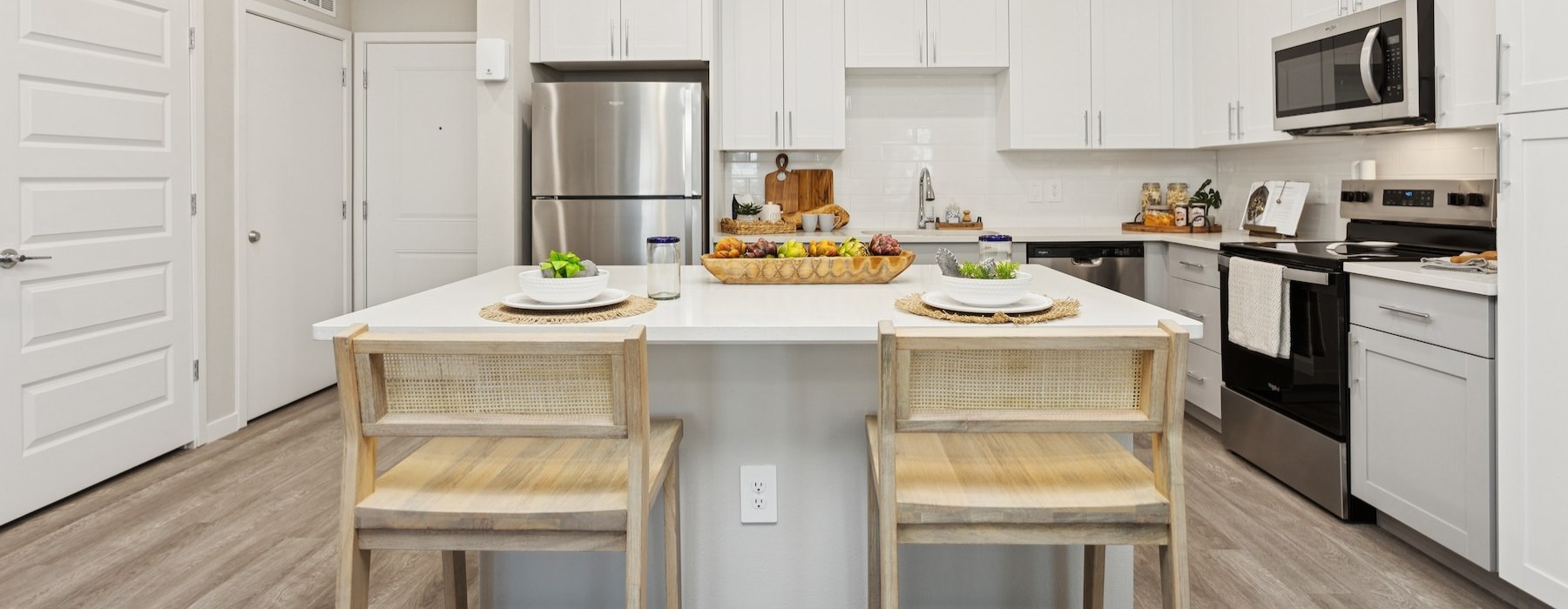 a kitchen with white cabinets