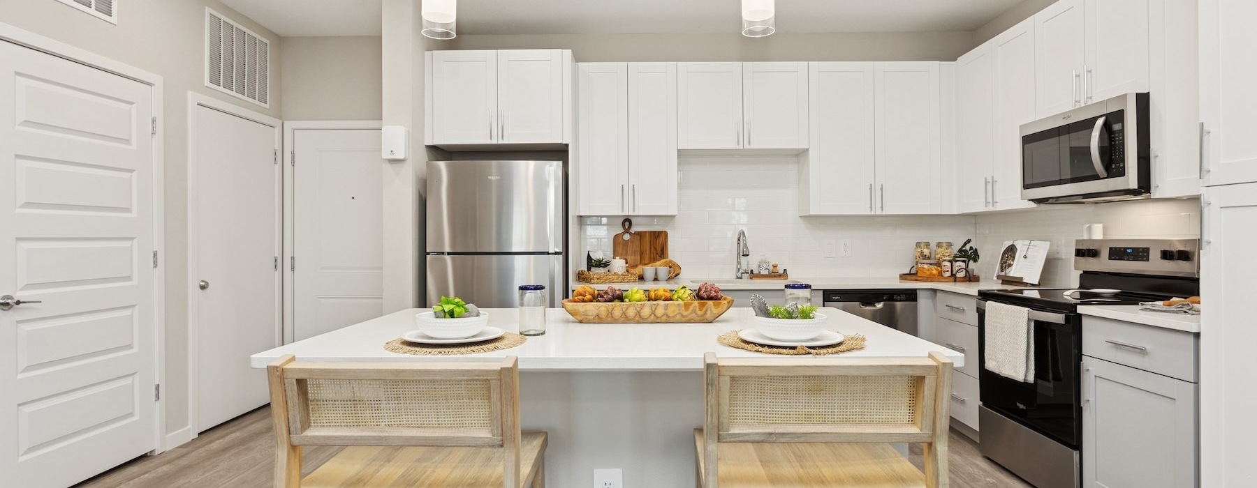 a kitchen with white cabinets