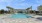 a swimming pool in front of a building