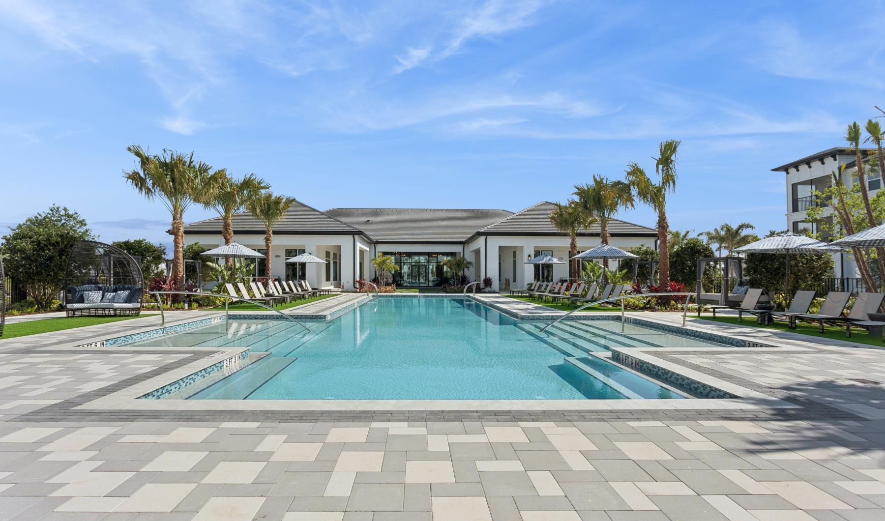 a swimming pool in front of a building
